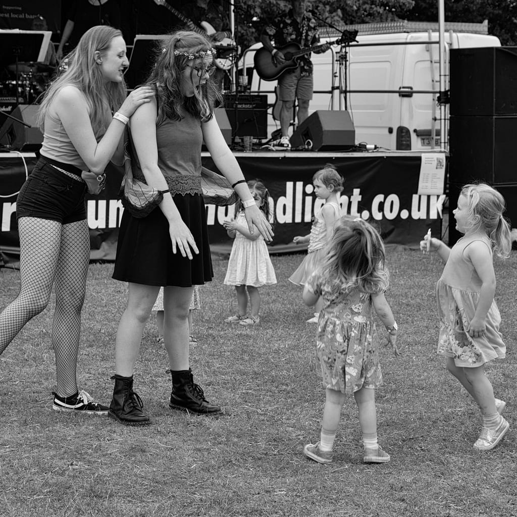 a group of women dancing in a field