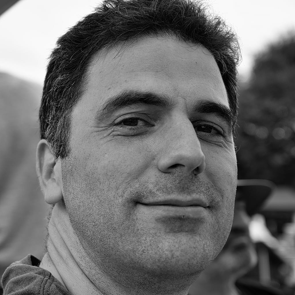 a man smiling for a picture
