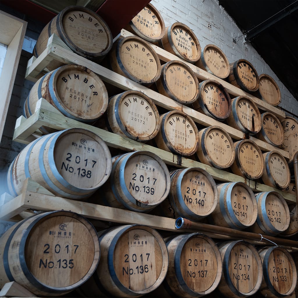 a group of wooden barrels on shelves