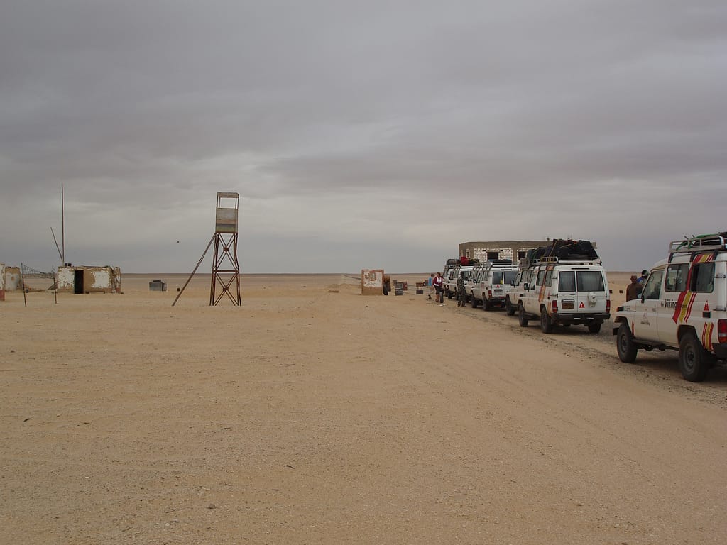 Egypt Eclipse Tour - A line of Landcruisers at a border check point