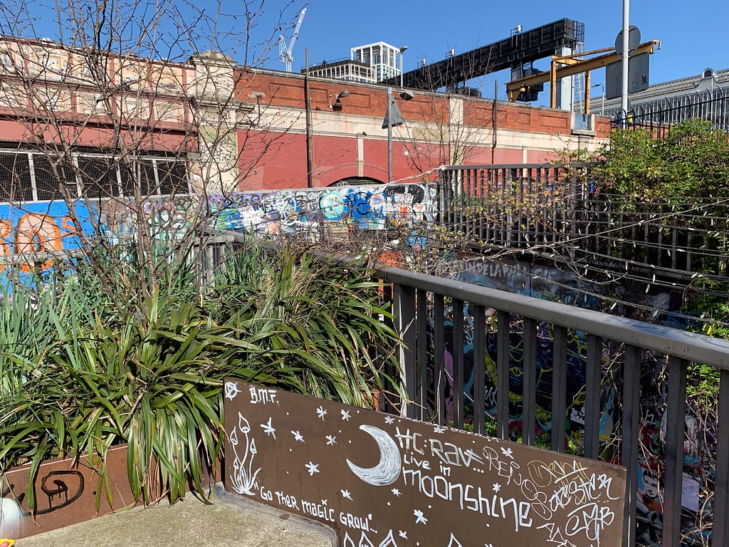 a fence with graffiti on it