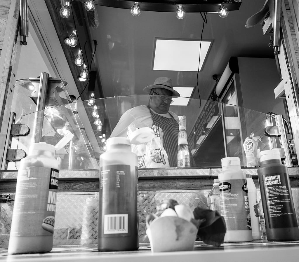 a man standing behind a counter