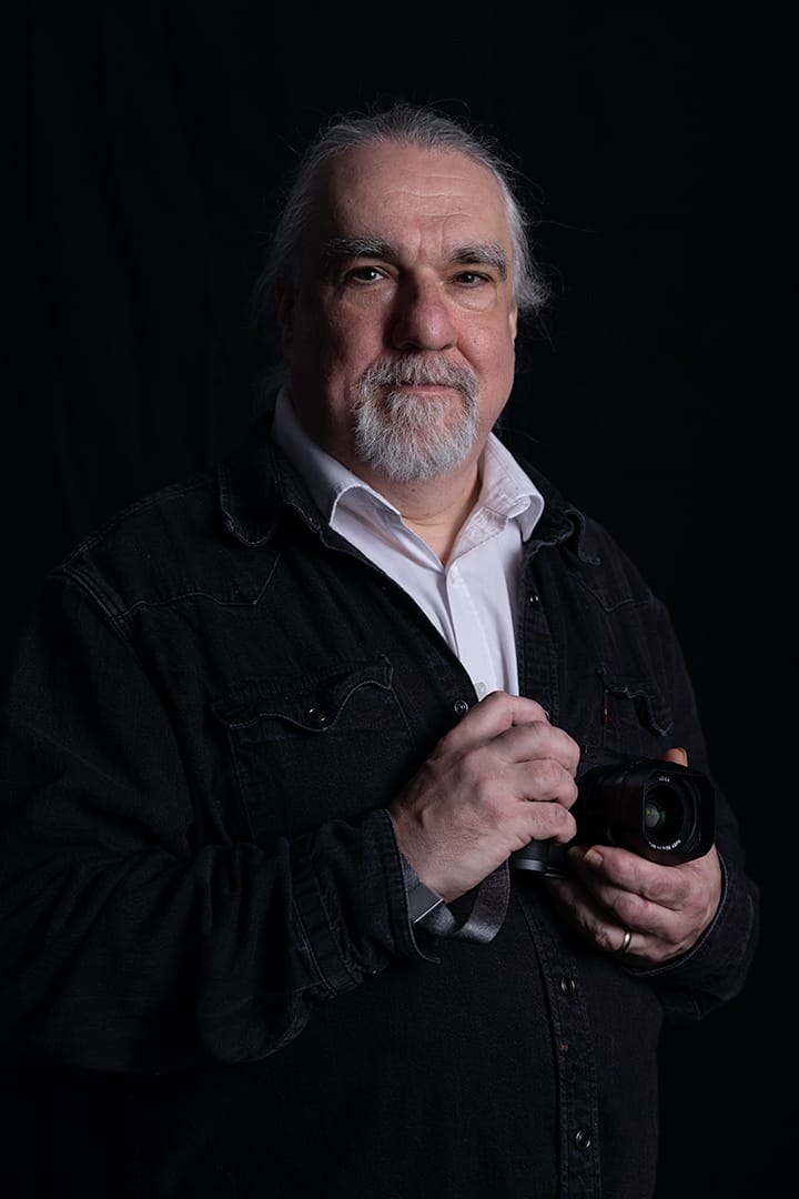 John Medany standing in front of the Golden Gate Bridge, California