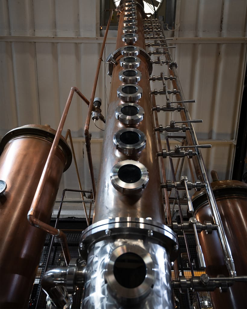 a large copper and silver machine